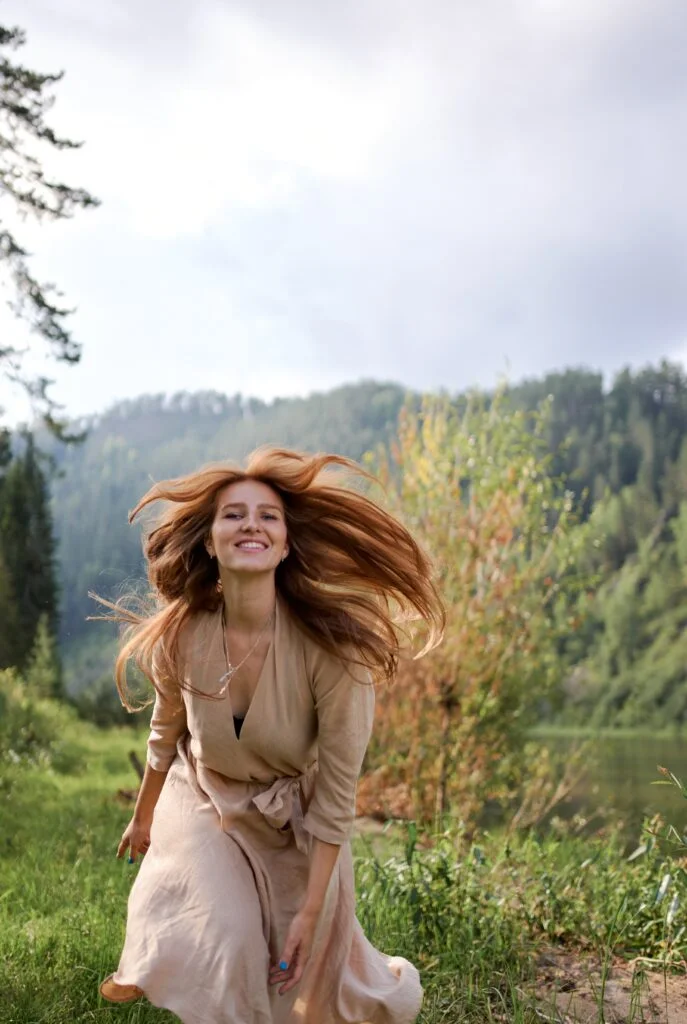 Happy woman running after healing from depression