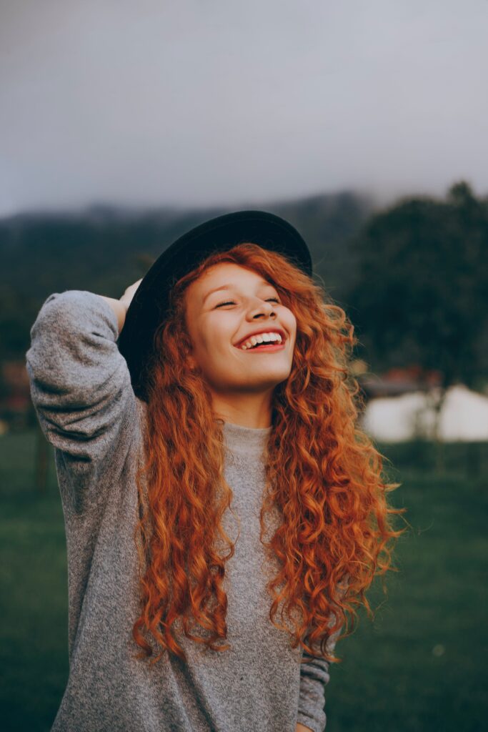 Rapid Resolution Therapy RRT - red haired woman laughing